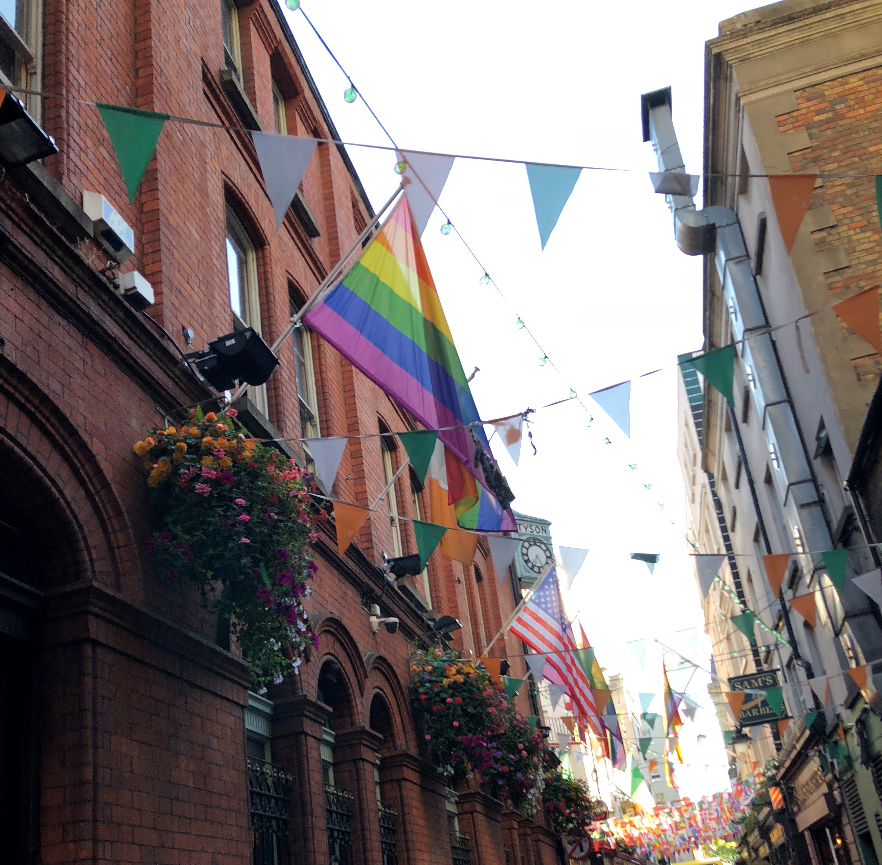 various flags lining a Dublin allyway