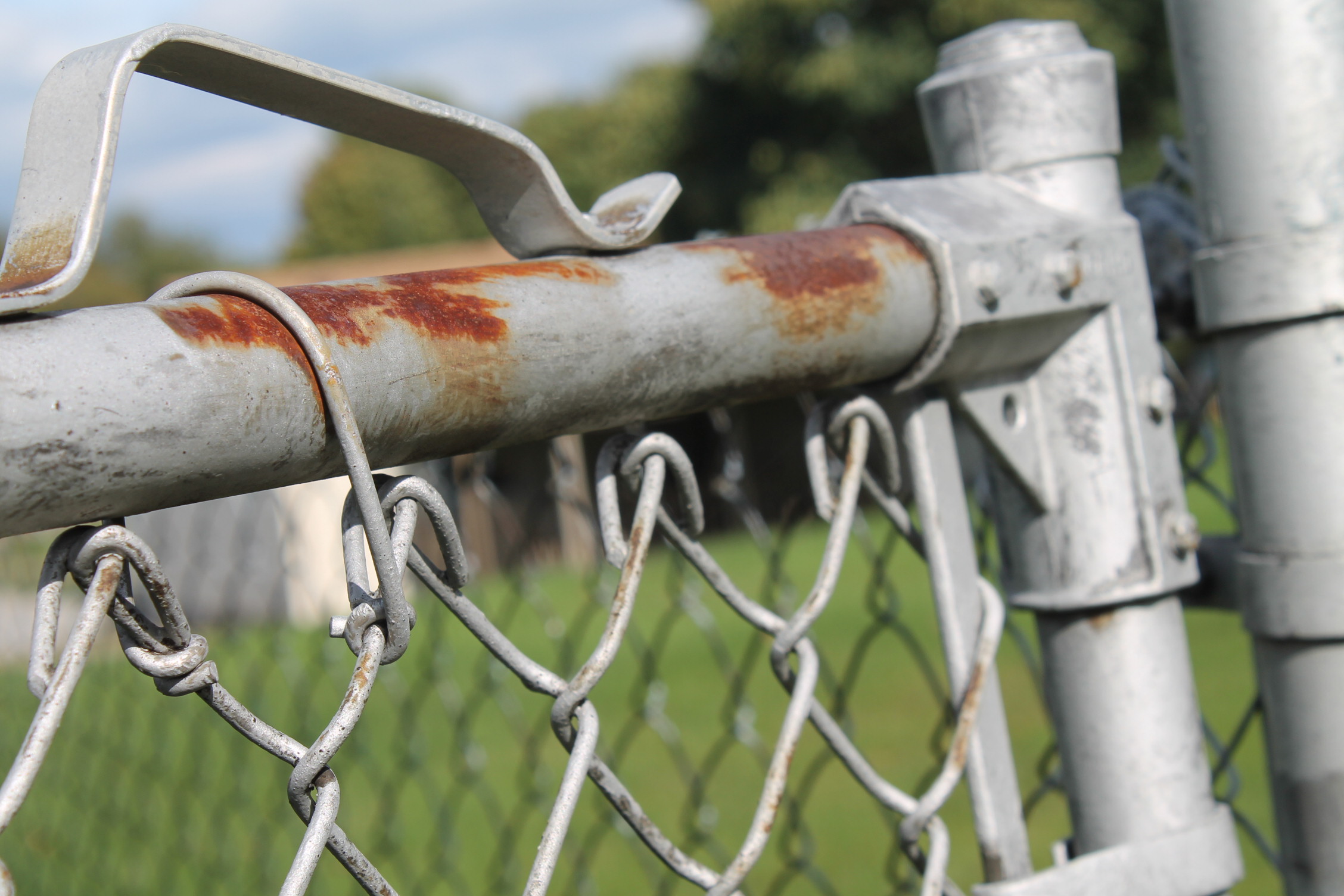 a rusted alluminium fence